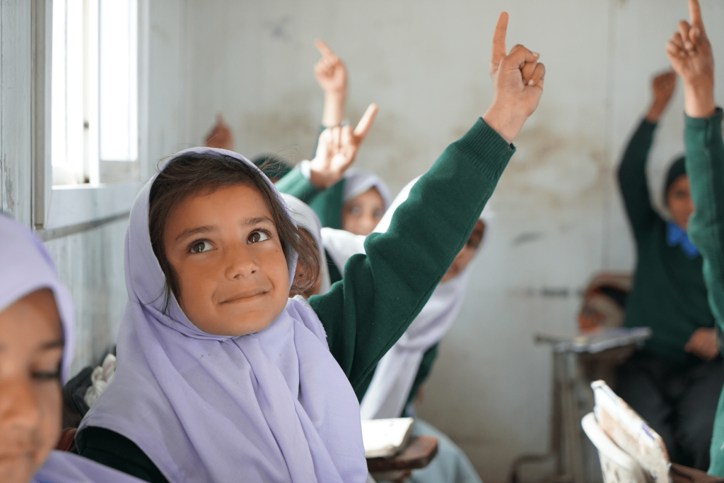 Girl Raising Hand in the Classroom